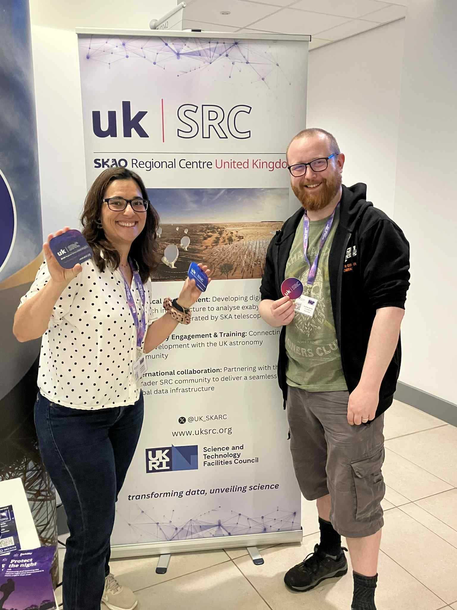 Lara and Andrew spreading the word about UKSRC. Standing in front of a UKSRC banner.
